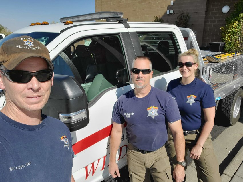 Ashley Cappel poses with two others on the Wildland Fire Team before deploying to the Cameron Peak Fire.